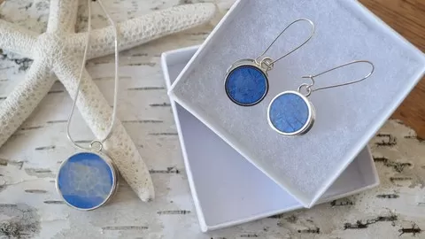 Make your own fashionable jewelry using tinted Resin to create a one of a kind Pendant and earring set.